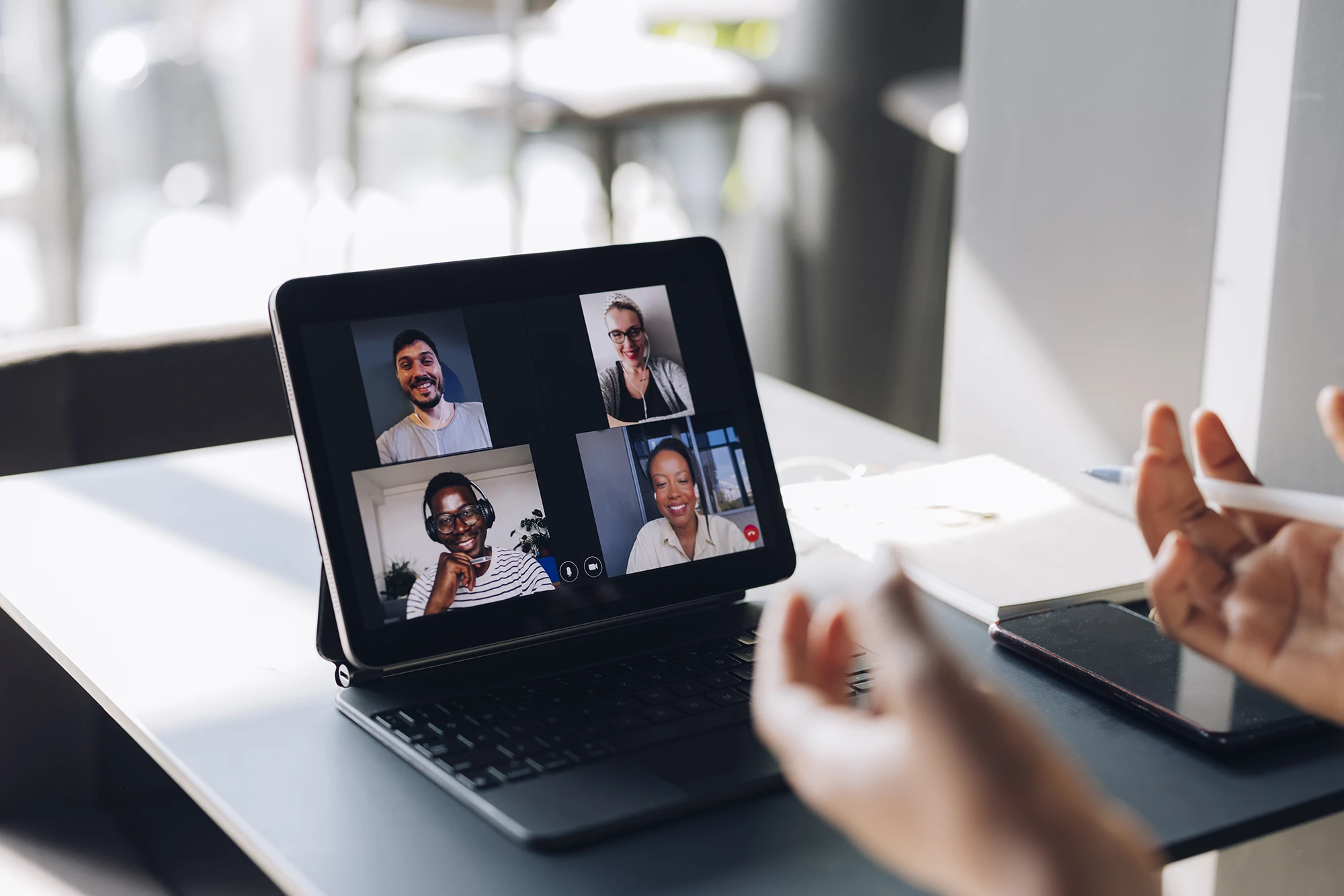 Photo of laptop with students on video call